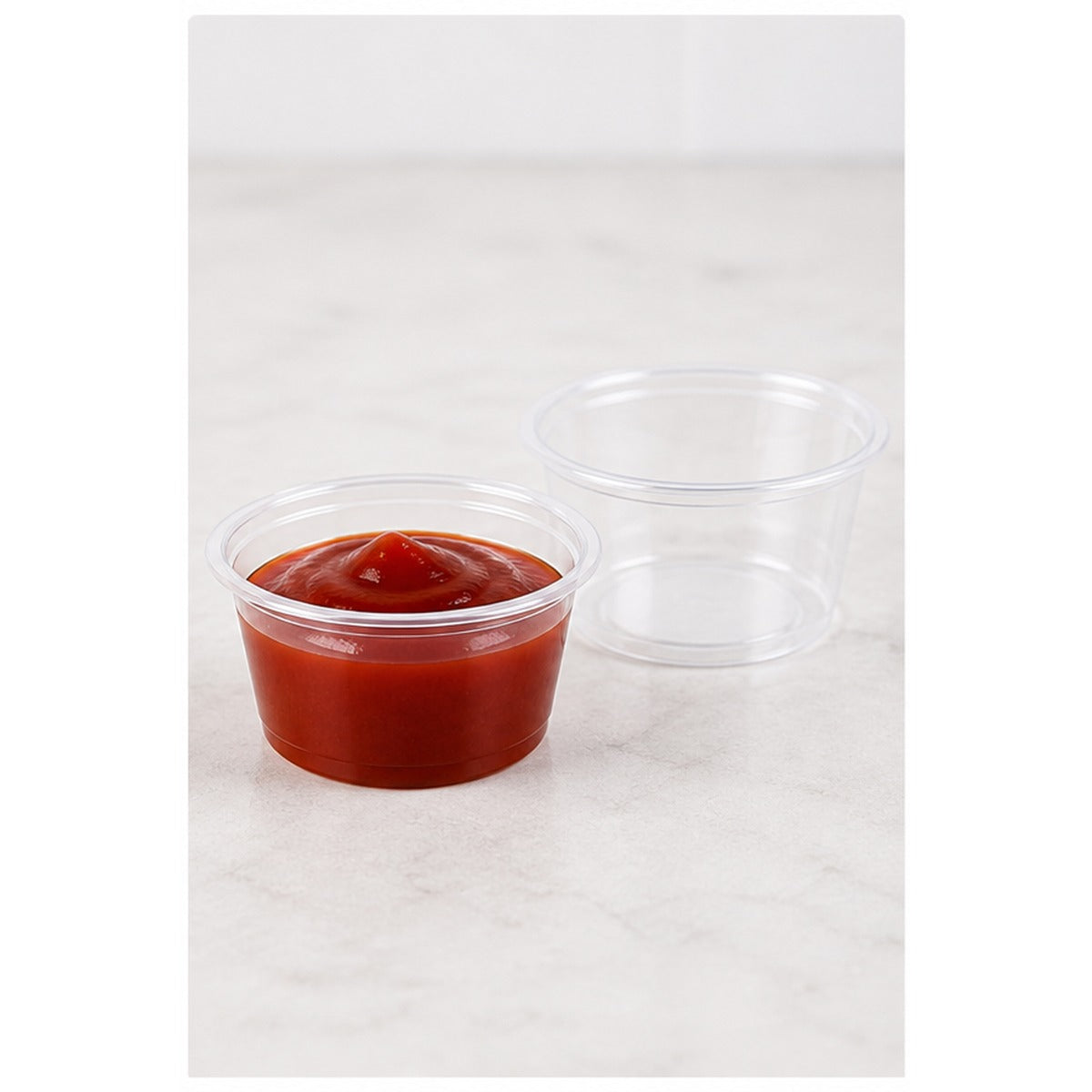 0.75 oz clear plastic portion cup filled with sauce - 2,500/Case