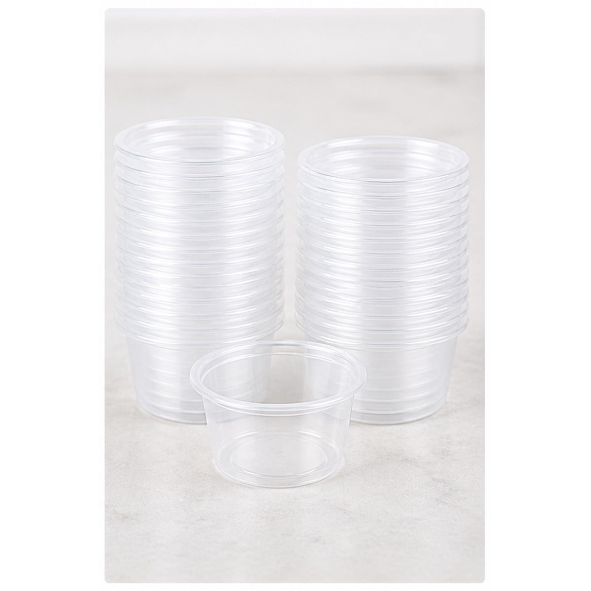 Stack of 0.75 oz clear plastic portion cups - 2,500/Case