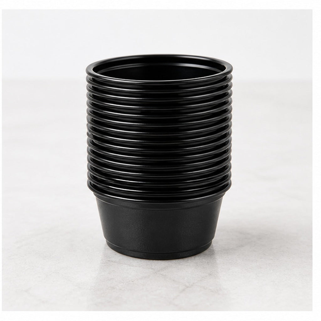 Stack of 1.5 oz black plastic portion cups - 2,500/Case
