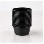 Stack of 1.5 oz black plastic portion cups - 2,500/Case