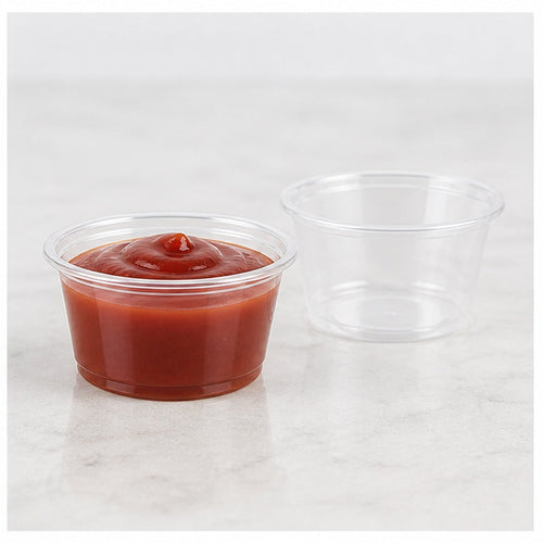 1.5 oz clear plastic portion cup filled with sauce - 2,500/Case
