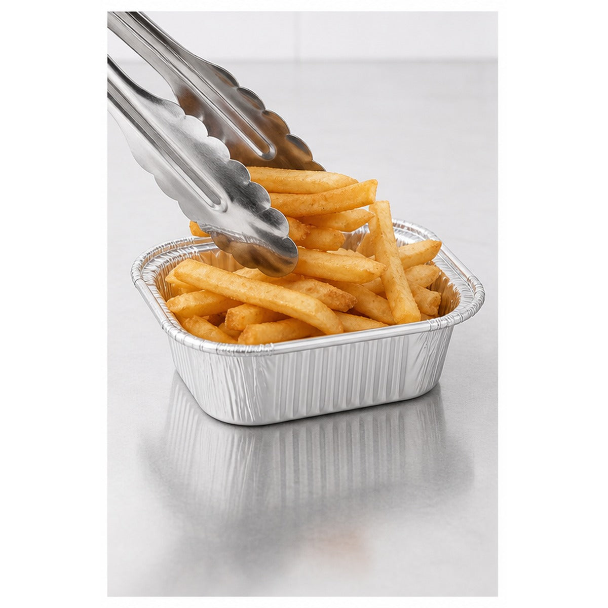 1 lb oblong foil take-out container filled with fries - 1,000/Case
