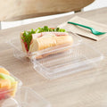 Clear Compostable PLA Hinged Clamshell Container 9" x 5" x 3" - 200/Case image 1 for NYC and Long Island restaurant supplies
